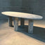 Green marble oval dining table with Bellini column legs.