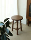 Round wooden stool with decorative turned spindle legs