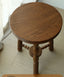 Round wooden stool with decorative turned spindle legs
