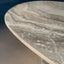 Luxurious green marble table with polished surface and oval design