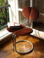 Wine velvet chair with stainless steel frame.