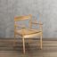 Solid wood chair with armrests in warm natural finish