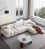 Modular premium furniture in a flexible living room with sectional seating, storage and adaptable layout for modern homes.