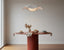 Premium dining table size guide scene with a well-proportioned dining table, chairs and room circulation space in a refined Australian interior.