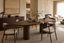 Tullio Oval Travertine Dining Table in a oval dining tables interior, styled with black, white, chrome and oxblood accents, showing premium furniture scale and luxury design context.