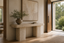 Serafina Wave Travertine Console in a entryway console interior, styled with forest green, travertine and blackened bronze, showing premium furniture scale and luxury design context.