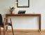 Minimalist premium furniture interior with clean-lined seating, low storage and quiet negative space for a clutter-free home.