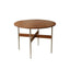 Round wooden dining table with amber finish