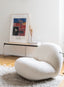 Plush cream bouclé accent chair with rounded organic shape