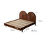 Wooden platform bed with dual circular rattan headboard panels