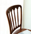 Beech wood chair with a smooth finish and graceful curves.