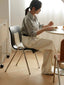 Woven rattan seat and backrest for added texture.