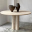 Minimalist round travertine marble table with dual cylindrical legs