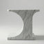 Marble-patterned side table on a plain background