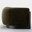 Elegant olive green armchair with a bold, rounded design and black base.