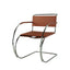 Minimalist leather lounge chair with a sturdy metal frame.