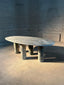 Luxurious green marble table with polished surface and oval design