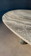 Luxurious green marble table with polished surface and oval design