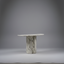 Modern marble console table with a unique fluted base design on a gray background