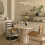 Round marble table with 3 chairs in a modern kitchen setting.