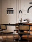 Wood Dining Table: Contemporary solid wood table with bold, clean lines.
