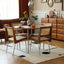 Round wooden dining table with amber finish