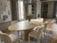 Aurelio Travertine oval dining table in a luxury home dining room
