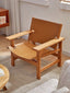 Rustic leather and wood chair for living room or lounge.