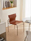 Retro-inspired chair with a refined design.