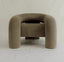 Gray curved armchair with cylindrical sides and plush upholstery