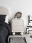 Modern bedside table with rounded edges and ball legs