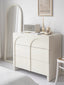 Modern cabinet with arched drawers and a glossy finish