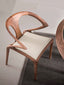 Modern dining chair featuring a minimalist walnut finish.