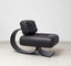 Modern cream leather chair with curved black wooden rocking base