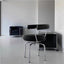 Black leather swivel chair with chrome frame