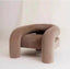 Gray curved armchair with cylindrical sides and plush upholstery