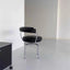 Black leather swivel chair with chrome frame