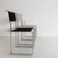 Black leather chair with tubular steel frame
