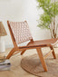Terracotta leather woven lounge chair with wooden frame in sunlit room