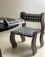 Bold and unique dining chair with curved design and retro charm.