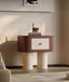  Unique cylindrical legs adding a sculptural element to the design.