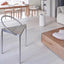 Minimalist curved metal chair with sleek silver frame