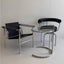 Black leather swivel chair with chrome frame