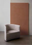Cream bouclé curved accent chair with black base