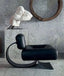 Modern cream leather chair with curved black wooden rocking base