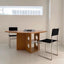 Black leather chair with tubular steel frame
