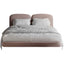 Soft fabric-upholstered headboard with elegant curves.