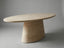 Aurelio Travertine oval dining table angled view showing the rounded top