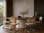 Serena Oval Walnut and Travertine Dining Table in a luxury dining room with beige travertine pedestal base and walnut oval tabletop.