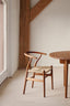 
Natural wooden wishbone chair with woven seat